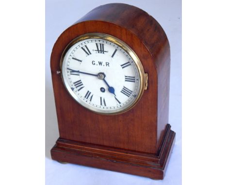 An early 20thC mahogany cased railway mantel clock, the white dial painted GWR, ivorine label to underside GWR 3195, movement