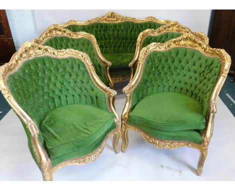 A Continental gilt gesso five piece salon suite, each carved with flowers and decorated with scrolls, in green buttoned uphol