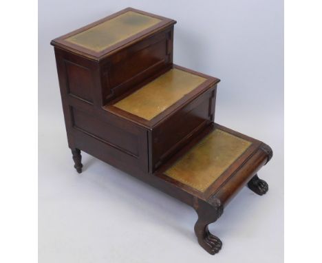 A set of early 19thC mahogany library steps, each with a brown and gilt tooled leather inset to the treads, a hinged lid to t