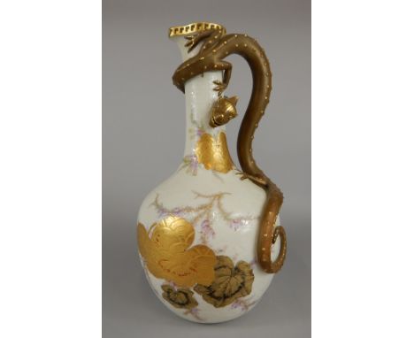 A Royal Worcester Dragon bottle vase, entwined with a dragon with scroll and trailing foliage decoration heightened in gilt, 