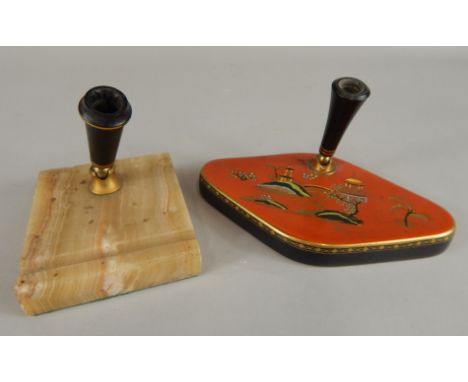 A Carltonware oriental style pen stand, decorated with a version of the Willow pattern in coloured enamels on a red ground wi