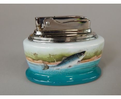 A Minton porcelain and silver plated lighter, decorated with a leaping salmon within a Scottish landscape, signed L Wood, 8cm