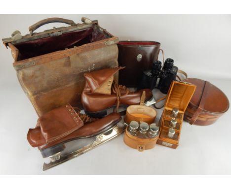 A quantity of leather items, to include a Gladstone bag, leather ice skates, a collar box, a portable cologne container and a