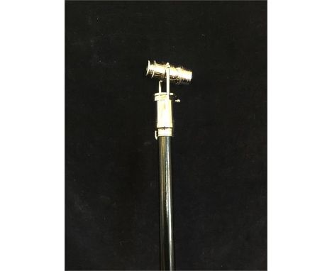 A walking stick with a telescope