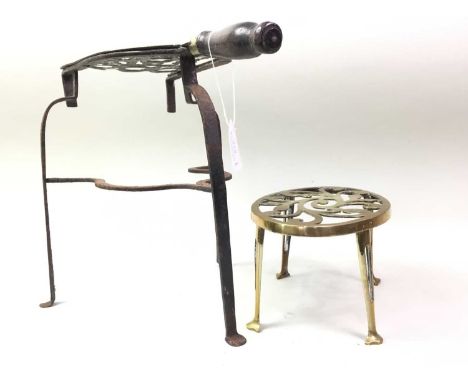 BRASS FIREPLACE SET, each with pierced scroll work, on tapered supportslargest 30cm high