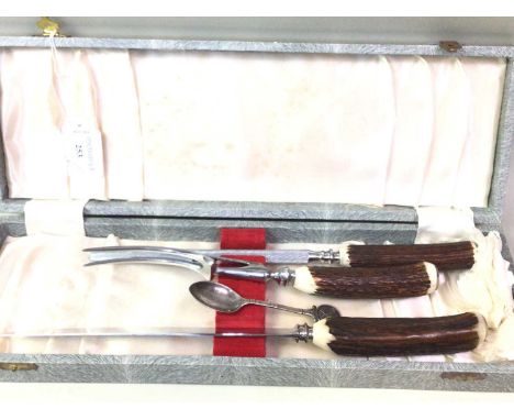 ANTLER HANDLED CARVING SET, C.1970s comprising a carving knife, fork and steel, in a fitted case, along with a set of plated 