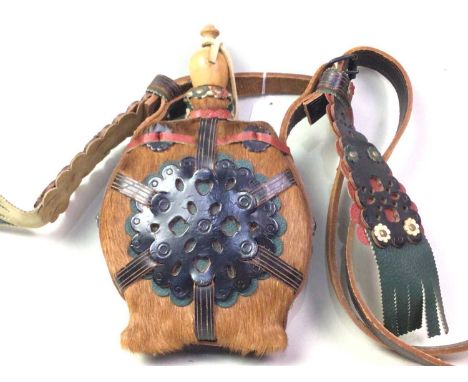 NATIVE AMERICAN STYLE FLASK CANTEEN, ALONG WITH A WHIP AND BATON the flask with leather and fur detailing, the whip of braide