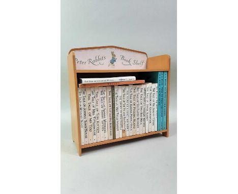 PETER RABBIT BOOKSHELF, ALONG WITH A COLLECTION OF BEATRIX POTTER BOOKS including the Tale of Peter Rabbit and further bookst