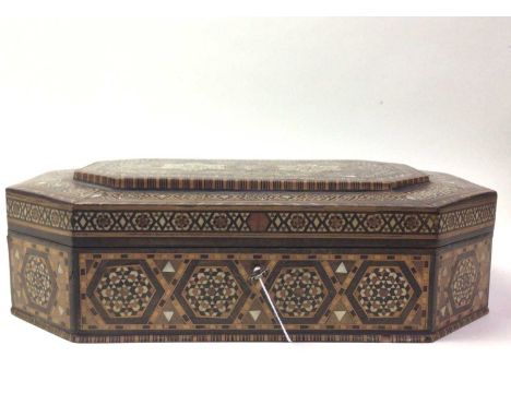 ANGLO INDIAN CASKET, 20TH CENTURY  of octagonal form and inlaid all over with mother of pearl, woods and bone, the hinged lid