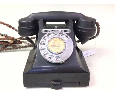 VINTAGE G.P.O. TELEPHONE, ALONG WITH A WEDGWOOD MATCH STRIKER the phone in black Bakelite, the striker with impressed marks t