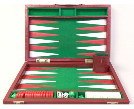 GAMES SET, AND A SMALL BROWN LEATHER GAMES BOX the set with counters, dice and board, in fitted red leather caseQty: 2Backgam