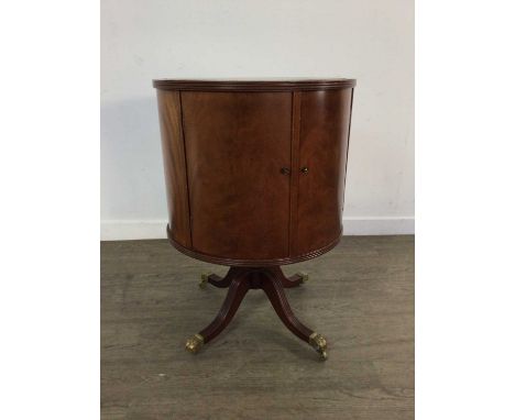 REPRODUCTION MAHOGANY DRUM DRINKS CABINET, with green leather inset top, with two doors73cm high, 52cm diameter