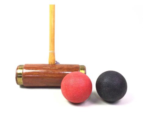 TWO CROQUET STICKS, MAKER JAQUES OF LONDON bearing makers name, along with two croquet ballssticks 97cm long