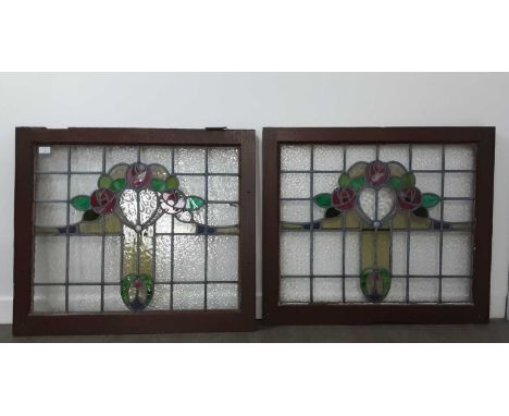 TWO STAINED GLASS PANELS, rectangular form, along with four rectangular panels, each with floral motifs, in wooden framesrect