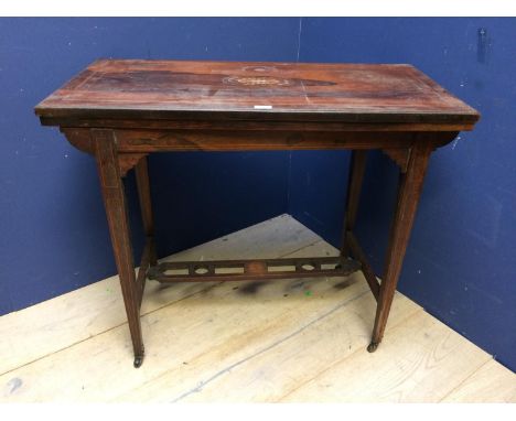 Late C19th/early C20th inlaid rosewood fold over oblong card table with green baize interior on tapered legs  united by pierc