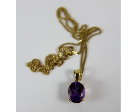 9 ct gold set amethyst stone on 9 ct gold chain. Total weight 3.25g 