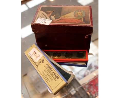 Mickey Mouse twelve glass slides and metal toy projector in original box, slides by Ensign Ltd