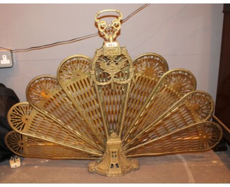 Brass peacock fire screen