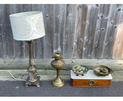 A set of 19th century table scales, with a white marble top, along with two brass table lamps 