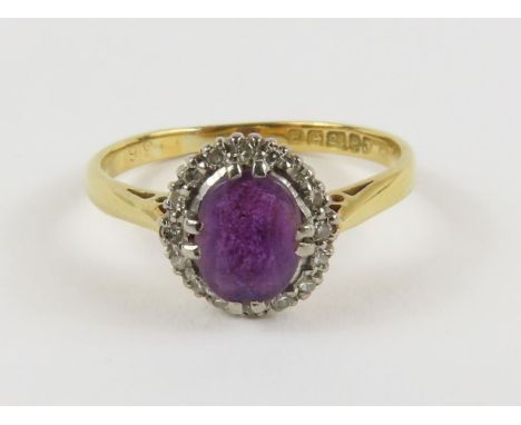 An 18ct gold amethyst and diamond cluster ring, finger size J 1/2, 2.2g gross