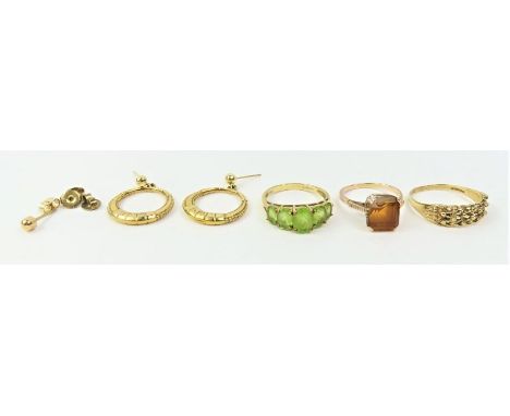 A 9ct gold peridot five stone dress ring, a 9ct gold ball and shot ring and a pair of earrings marked '9ct', 7.39g gross; a s