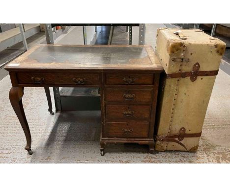 A 20th century travelling trunk, along with oak writing desk 76cm high, 104cm long, 60cm wide