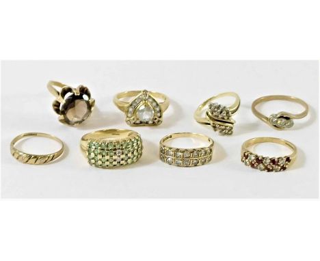 A 9 carat gold Gem TV stone set ring; with seven other stone set 9 carat gold rings; 19.3g gross