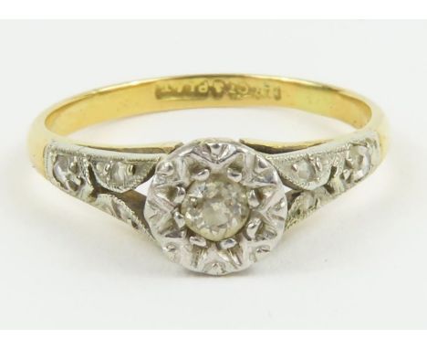 An illusion set diamond solitaire ring, marked '18ct plat', finger size I 1/2, 1.9g gross