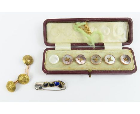A cased set of five grey mother of pearl buttons, with faux thread decoration; three Russian buttons, a single white mother o