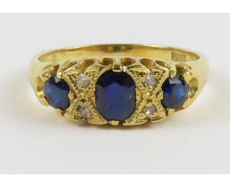 A sapphire and diamond ring in the Edwardian style, finger size N 1/2, tests as 18ct gold, 3.7g gross