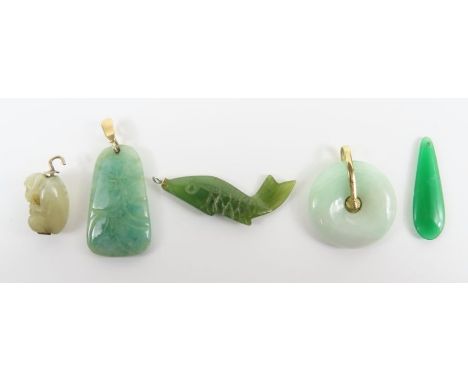 A pi jade pendant, with a bale marked '9k'; a piece of green hardstone carved as a fish charm; together with three other pend