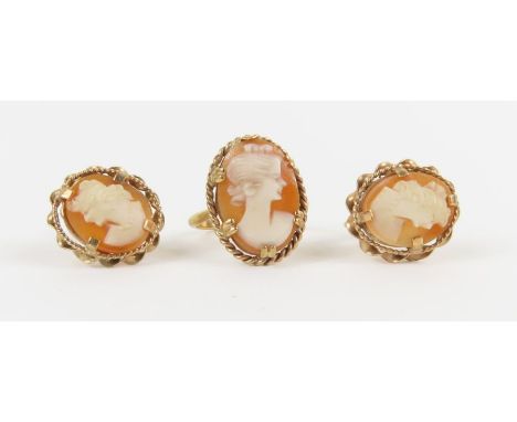 An orange shell cameo ring, marked '9ct', finger size L, 2.57g gross; and a pair of orange shell cameo screw on earrings, mar