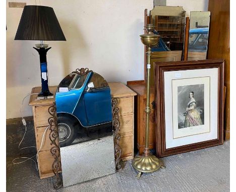 A 20th century brass standard lamp, print of Queen Victoria, wall mirror and a glass table lamp