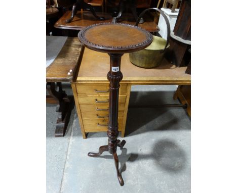     A Mahogany Tripod Torchere Stand                                                