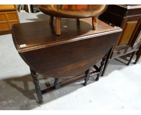     An Early 20th Century Polished Oak Gate Leg Table On Barley Twist Supports      