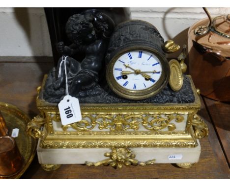     An Ormolu Mantel Clock, The Circular Dial Marked Stiffel & Cartier, 10.5" High  