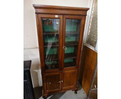     An Early 20th Century Two Door Bookcase Cupboard, With Two Panel Doors Below    