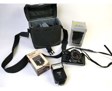 Canon A1 camera with bag and lens and boxed Hanimex Macro Zoom 28-200 mm lens