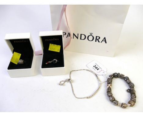 Pandora charm bracelet, two boxed Pandora charms and Philip Jones white metal bracelet