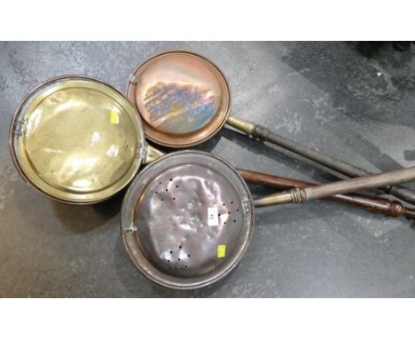 Three brass and copper bed warming pans