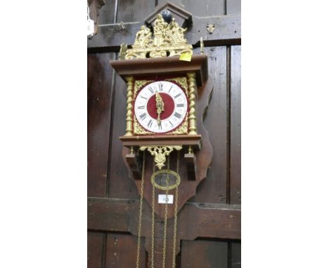 Wood and brass effect wall clock with train and weights