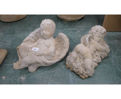 Two cherub form composite garden ornaments