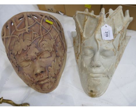 Two garden planter wall pockets formed as The Green Man
