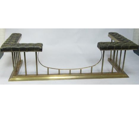 A brass and button upholstered green leather club fender, 181cm x 73cm x 55cm, internal 158.5cm x 62cm.