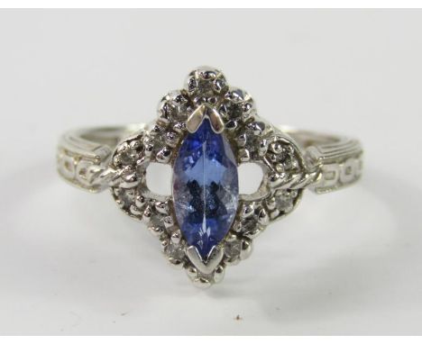 A 14ct white gold tanzanite and diamond set dress ring, size R, 4.5g.