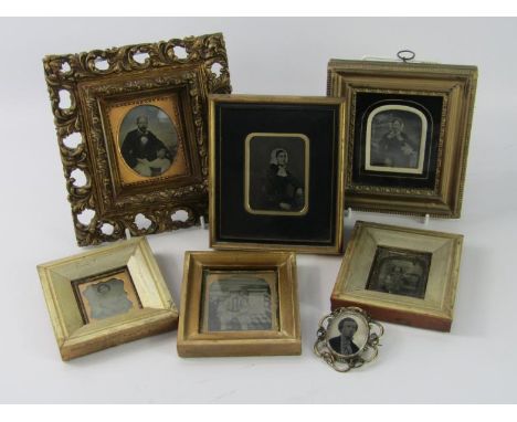 Six framed Victorian daguerreotype and other portrait photographs, and a three dimensional photographic bust portrait, brooch