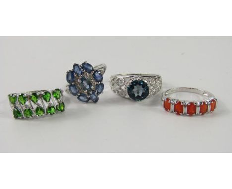 A 9ct white gold blue sapphire and diamond ring, 9ct white gold and London blue topaz ring, 9ct white gold and cherry fire op