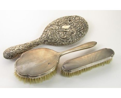 A silver backed hair brush and clothes brush, with engine turned decoration, Birmingham 1964. and a Victorian silver backed h