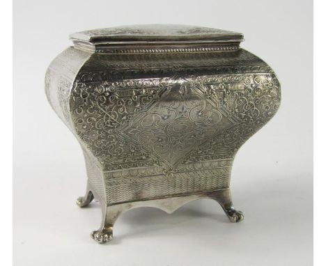 A French late 19thC white metal tea caddy, of bombe form, with a hinged lid, engraved with foliate scrolls within a basket we
