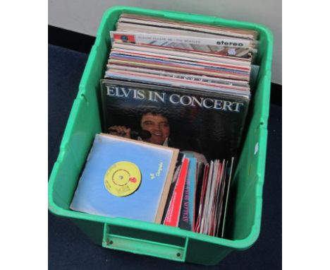 A collection of vinyl records, comprising singles, EPs, packs and LPs, including Beatles The White Album, Rolling Stones, Que